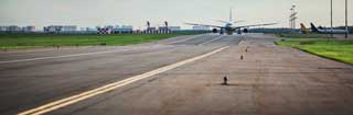 jet airliner taking off - long shot down the runway